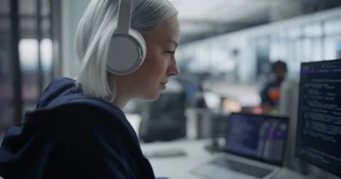 Female Software Developer Writing Code on Computer Stock Footage 296184008