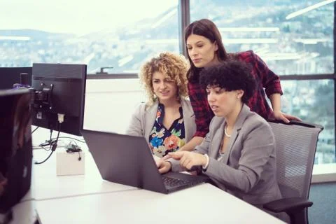 Female software developers using laptop computer Stock Photos