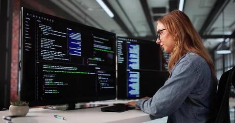 Female Software Engineer Developing Code On Office Computer Screen Closeup 스톡 사진
