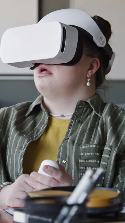 Female Software Tester with Down Syndrome Using VR Headset in Office Stock Footage 275601389