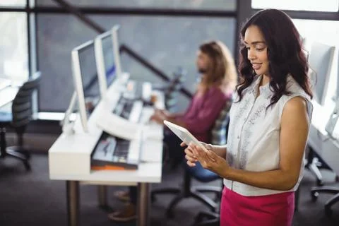 Female sound engineer in studio using digital tablet Stock Photos