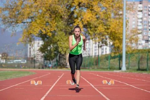 Female Sprinter Getting Ready to Start The Race Foto stock