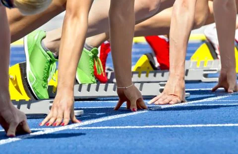 Female sprinter start Stock Photos