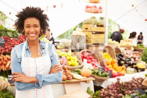 Female Stall Holder At Farmers Fresh Food Market Stock Photos