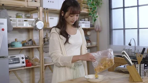 Female standing at the home kitchen 動画素材 154952097