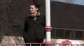 Female standing in park waiting for someone HD Footage