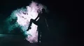 The female standing in twine in the smoke cloud. night time, slow motion 4k or 4k+ Resolution