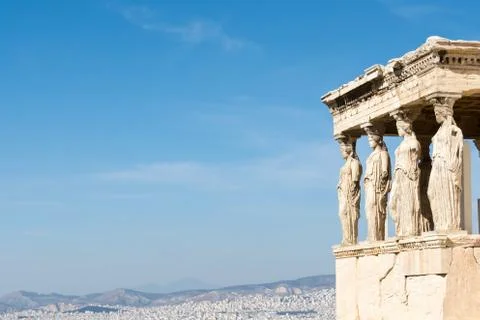 Female statues called caryatids in the Erechtheion at the sacred rock of the  Stock Photos
