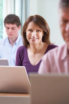 Female Student In Adult Education Computer Class Stock Photos
