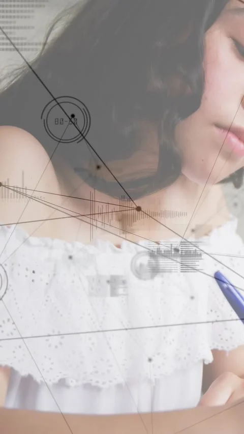 Female student bringing pen into frame and taking notes with HUD charts shifting Stock Footage 331270990