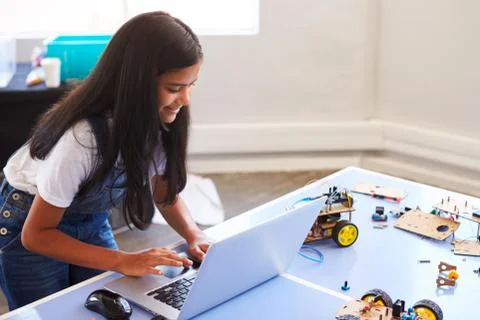 Female Student Building And Programing Robot Vehicle In After School Computer Stock Photos