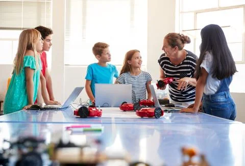Female Student Building And Programming Robot Vehicle In After School Computer Stock Photos