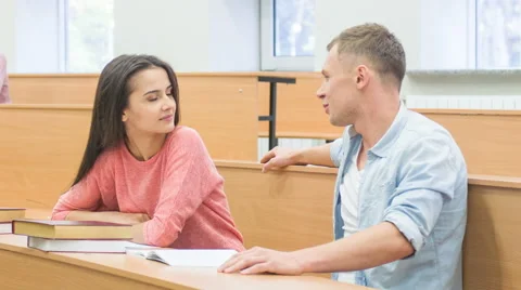 Female student chatting with her classmate Stock Footage 57688081