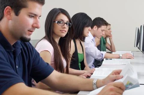 Female Student With Classmates In Computer Lab Stock Photos