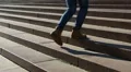 Female student climbing stairs on the way to university, happy college life HD Footage