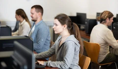 Female student at computers in university computer class Stock Photos