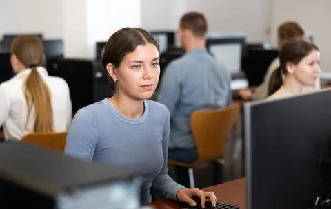 Female student at computers in university computer class Stock Photos