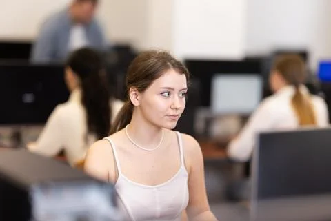Female student at computers in university computer class Stock Photos