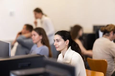 Female student at computers in university computer class Stock Photos