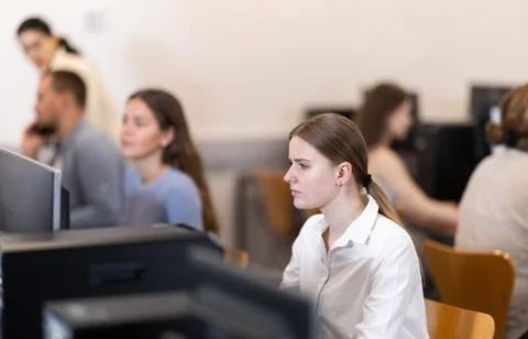 Female student at computers in university computer class Stock Photos