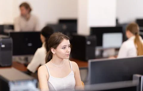 Female student at computers in university computer class Stock Photos