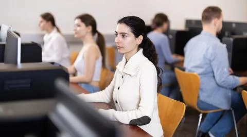 Female student at computers in university computer class Stock Photos