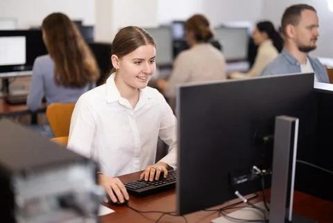Female student at computers in university computer class Stock Photos