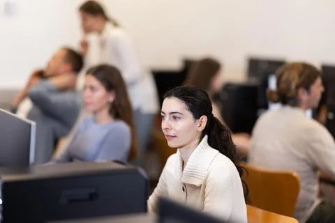 Female student at computers in university computer class Stock Photos