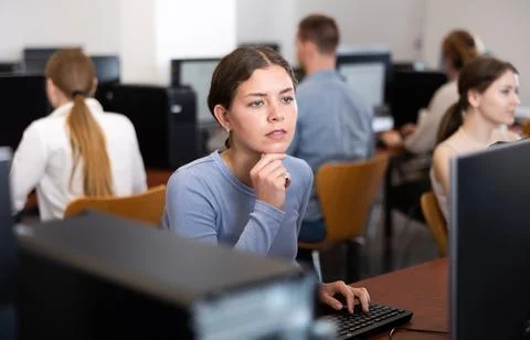 Female student at computers in university computer class Stock Photos