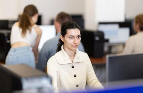 Female student at computers in university computer class Stock Photos