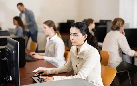 Female student at computers in university computer class Stock Photos