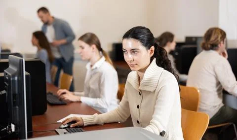 Female student at computers in university computer class Stock Photos