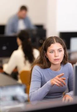 Female student at computers in university computer class Stock Photos