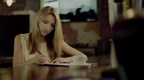 Female student doing homework Stock Footage 67983620