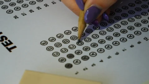 Female student hand testing doing examination test with standardized test Stock Footage 121517659