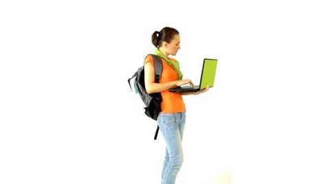 Female student with laptop, isolated on white Stock Footage