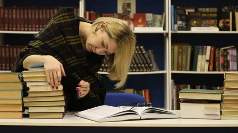 Female student in the library Stock Footage 46040873