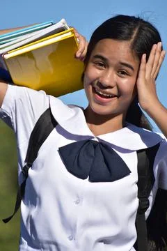 Female Student Memory Problems Holding Textbooks 스톡 사진