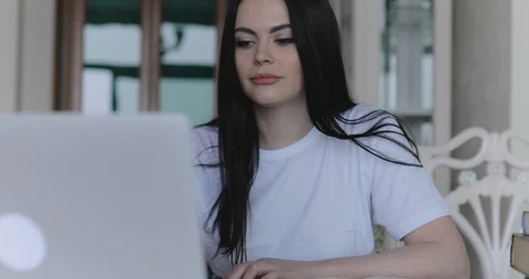 The female student noting during remote online studying in home Vídeo Stock 128976744