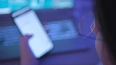 Female student prepares homework using mobile phone laptop indoors slow motion Stock Footage 266265158