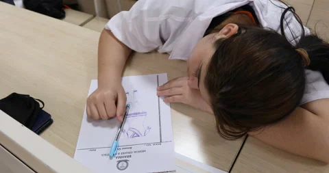 Female student sleeping on study table Stock Footage 171206806