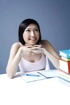 Female student smiling while looking up Stock Photos