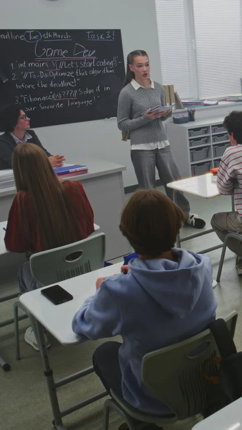 Female Student Stands Confidently, Reading Presentation Diverse Group Classmates Stock Footage 321005320