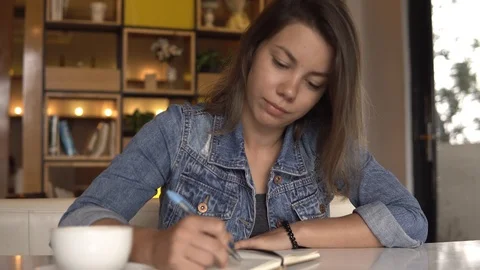Female student studying in cafe Stock Footage 88683816