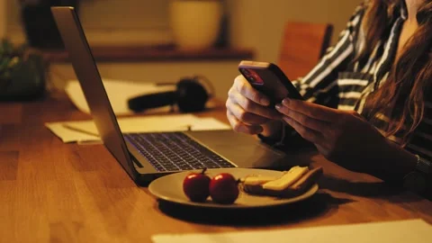 Female student studying late having late dinner sandwich, using laptop computer Stock Footage 221554776