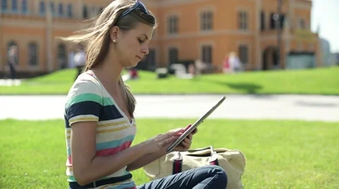 Female student with tablet computer on campus, steadicam shot HD Stock-Footage 12133748