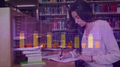 Female student taking notes in spiral notebook at library table as data overlays Stock Footage 330238563
