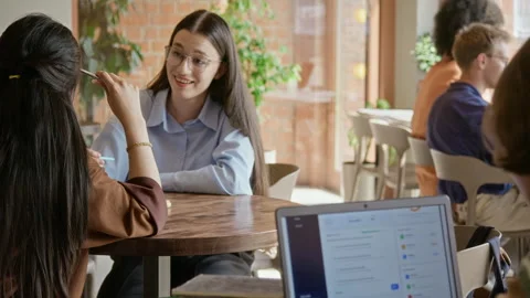 Female Student Talking and Smiling with Classmate in University Cafe Stock Footage 342127946