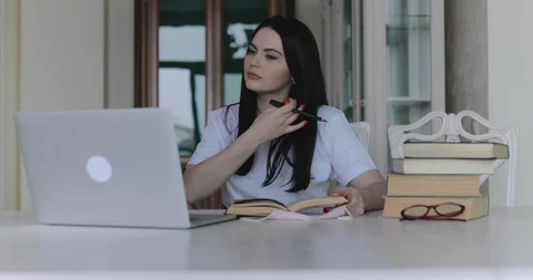 Female student talking on website during remote online studying in home Vídeo Stock 129424099