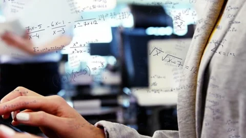 Female student tapping tablet, activating math overlay, camera pulling back Stock Footage 334729156